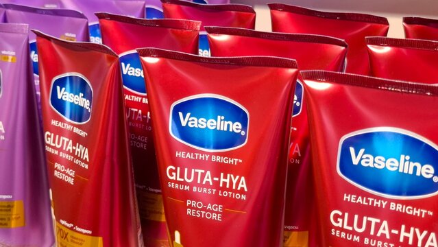 Close up of Vaseline Healthy Bright Gluta Hya Serum Burst Lotion Pro Age Restore Tubes Displayed in Rows for Sale on Retail Beauty Department Shelf on February 27, 2026 in Bangkok, Thailand