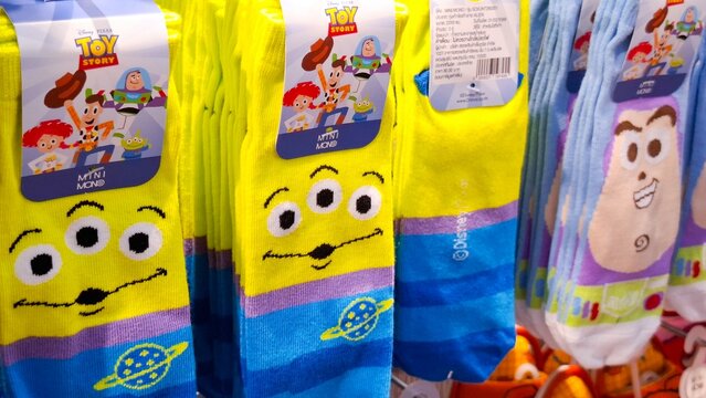 Colorful Disney Pixar Toy Story themed socks featuring Alien and Buzz Lightyear characters on retail display rack on February 27, 2026 in Bangkok, Thailand