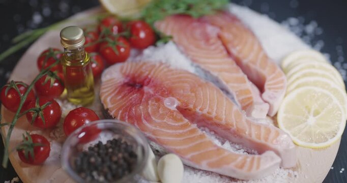 Fish fillets of raw salmon with lemon and spices