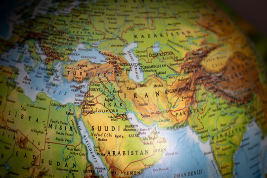 A world map focused on Iran. The United States and Israel declared war on Iran. Political tension in the Middle East. Economic and oil crises caused by the war. Countries and borders. 