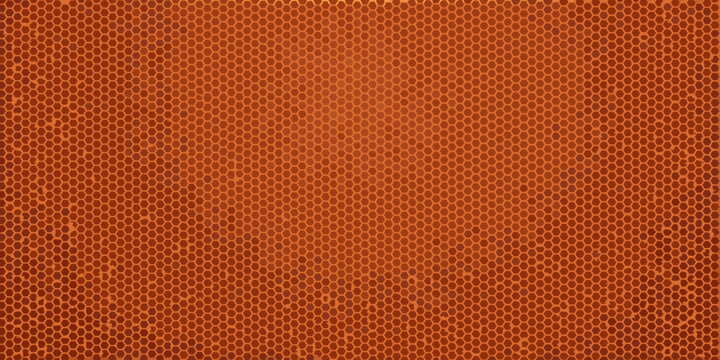 Close up of an orange basketball s textured surface with repeating patterns