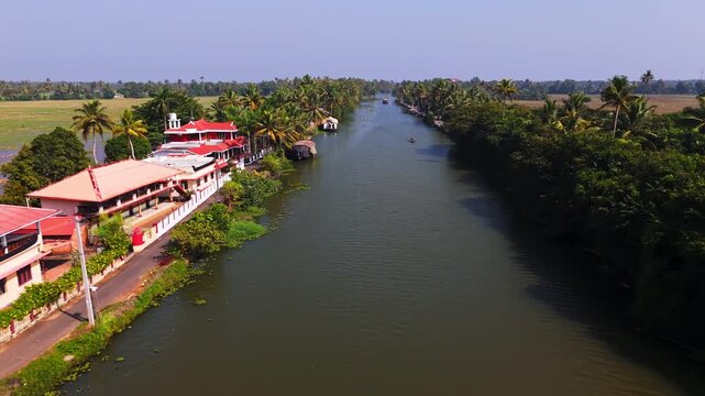 Aerial view along a canal in the backwaters of Kochi, Kerala, sunny day in India