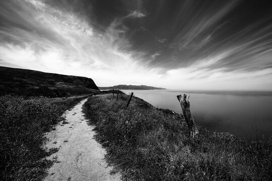 North Bluff hiking trail on Santa Cruz island in the Channel Islands National Park off the gold coast of southern California United States - low key black and white