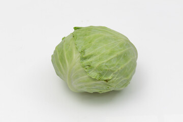 Fototapeta premium Fresh Green Cabbage Head Isolated on White Background, Whole Organic Leafy Vegetable with Natural Texture and Layered Leaves, Healthy Food Concept in Studio Lighting with Selective Focus
