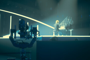  Professional Robotic Camera Filming a Piano Performance with Cinematic Lighting and Copy Space © Aliaksei