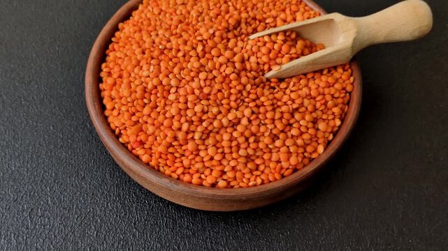 Raw red lentils as a source of protein for a healthy vegan meal. Red lentils as a food background for your design