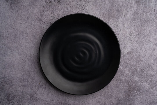 Black Rounded Ceramic Plate Marble Background