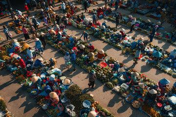 Fototapeta premium Aerial view of busy local daily life of the morning local market in Vi Thanh or Chom Hom market, Mekong Delta, Vietnam.