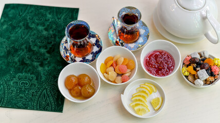 Traditional Tea Service with Assorted Sweets, Jams, and Dried Fruits
