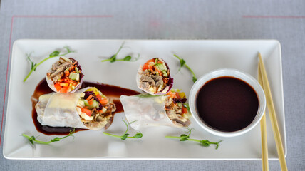 Fresh Spring Rolls with Dipping Sauce and Chopsticks