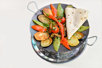 Grilled Vegetables and Meat Dish with Flatbread in a Pan