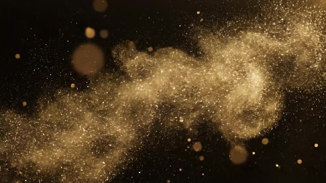 Golden glitter particles explode and spread across a dark background with bokeh