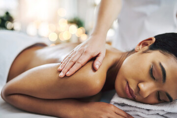 Obraz premium Woman, relax and back massage with masseuse at spa for stress relief, muscle healing and pamper. Hands, people and physical therapy with bokeh, skincare treatment and therapeutic session for wellness