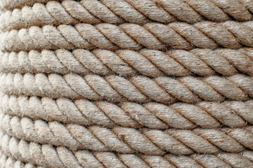 Close up twisted jute rope strands showing coarse fibers © VERSUSstudio