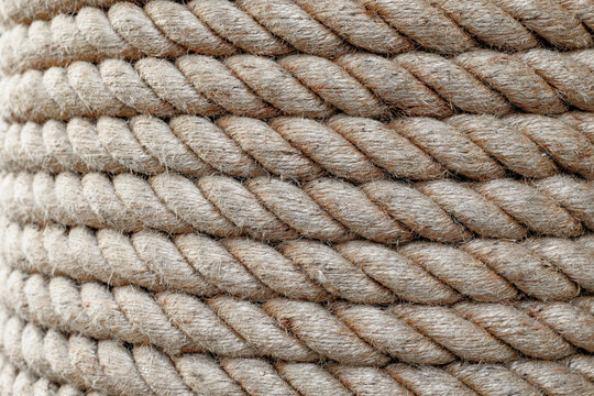 Close up twisted jute rope strands showing coarse fibers