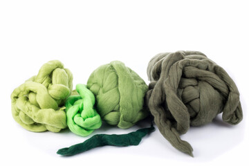Skeins of natural merino wool on a white background