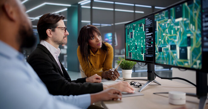 Diverse Team Collaborating On PCB Design