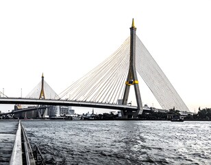Obraz premium Cable-stayed bridge over rippling water under bright sky, featuring two towers and numerous suspension cables