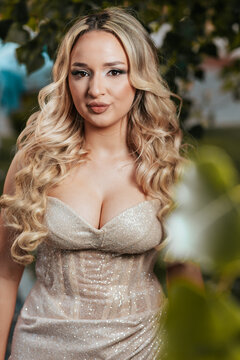 Blonde Teen in Sparkle Prom Dress, Smiling, Garden Background