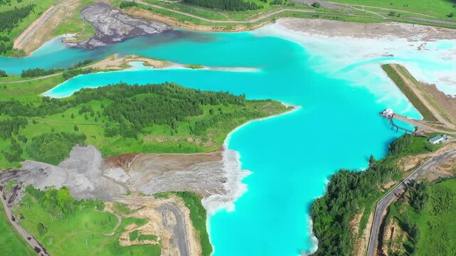 View over waste water lake at ash dump of thermal power. Problem of environmental pollution. Irrational use of fresh water.