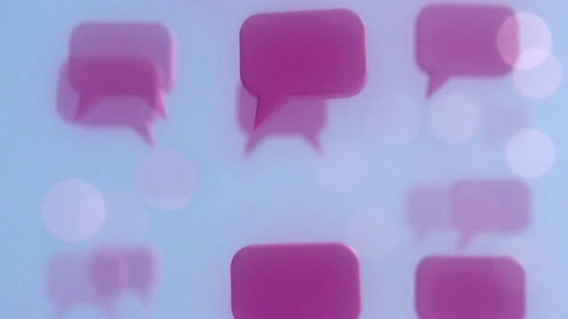 Pink speech bubbles floating on a soft blue background, symbolizing communication and conversation.