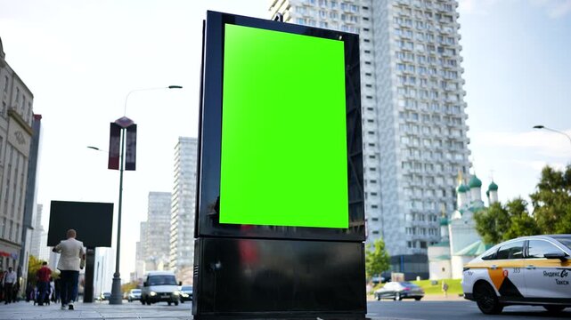 Outdoor green screen billboard on a Moscow city street for advertising mock-up