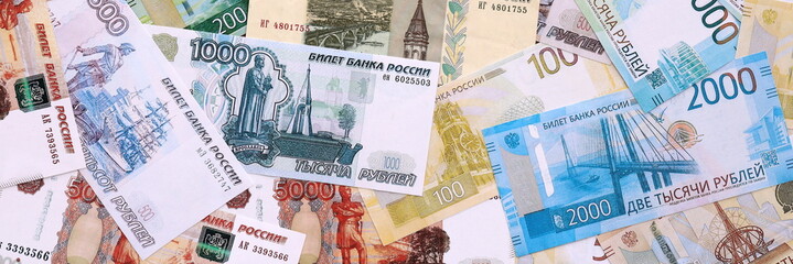 Russian ruble money bills pile on table. Russia banknotes of RUB currency close up.