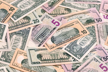 United States dollars money bills pile on table. USA banknotes of USD currency close up.