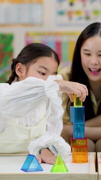 Asian Teacher and Primary Students Learning Geometry with 3D Shapes