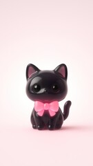 Fototapeta premium Cute black cat figurine wallpaper.
