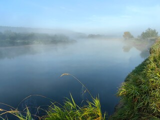 Morning fog over the river, summer landscape.