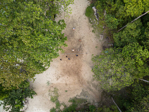 Aerial view of the sandy beach and surrounding lush greenery creating a striking contrast, Tanjung Gelam Beach, Karimunjawa, Central Java, Indonesia.