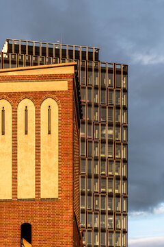 Traditional brick tower architecture facade with windows under modern urban sky showing strong contrast for background design and city renewal concepts