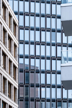 Modern urban office architecture facade with glass windows and sharp geometry lines delivering bold contrast for professional background and branding design