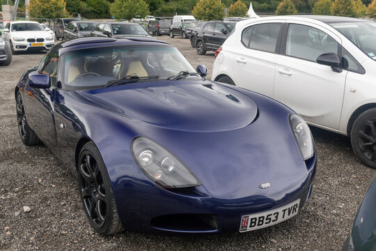 Stavelot, Belgium - September 21st 2025 : View on a blue TVR T350 parked on a parking lot surrounded by other cars.