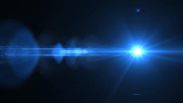 Bright blue lens flare effect illuminates a dark background with horizontal