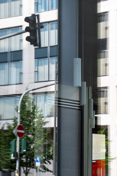 City street intersection with traffic sign on pole near building in daylight showing urban infrastructure and clear road control message with clean modern composition and copy space