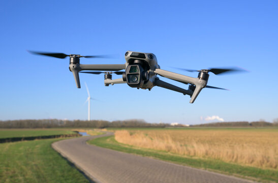 Drone flying above rural winter landscape in the Netherlands