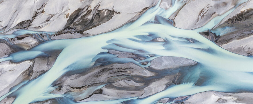 Aerial view of Icelandic braided glacial river with turquoise meltwater