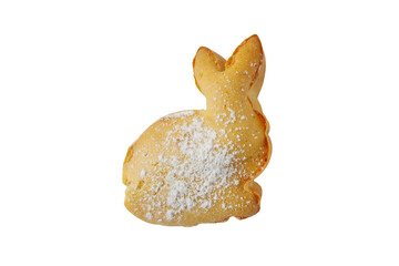 Bunny shaped cookie with powdered sugar on top placed on a white background during daytime