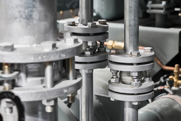 Industrial valves and pipe fittings, close up engineering detail.