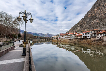 Naklejka premium Old Ottoman houses panoramic view by the Yesilirmak River in Amasya City. Amasya is populer tourist destination in Turkey.