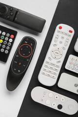 Different remote controllers on white and black background