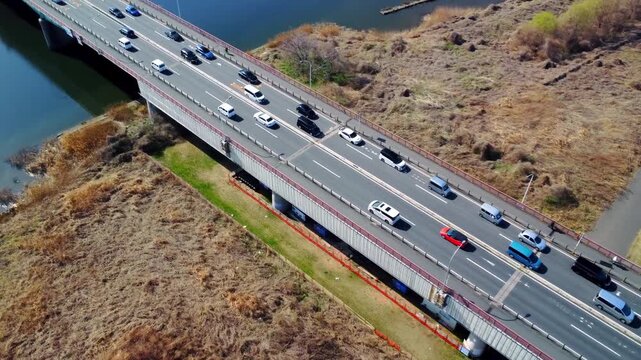 車通りの多い橋を空撮　4K