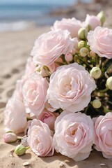 wedding bouquet of pink roses on white sand