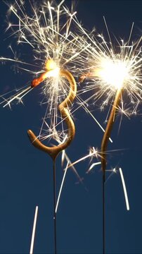 37 years celebration festive background made with Bengal fires in the form of number Thirty seven. Vertical video.