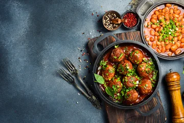 Fotobehang Eten Delicious fried meatballs in a metal frying pan. Close-up. Meat dishes.  © Yaruniv-Studio