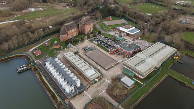 Aerial view of the complex architecture of Severn Trent Water treatment plant and its surrounding ponds, a blend of industrial and natural elements, Birmingham, England, United Kingdom.