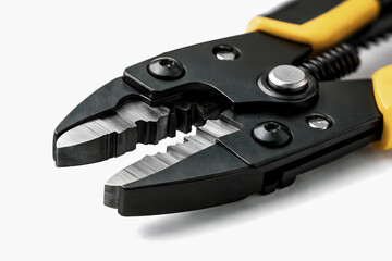 Close Up of Black and Yellow Pliers Tool Isolated on White Background