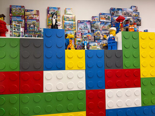 Naklejka premium Colorful giant lego brick display with minifigures